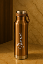 Bronze water bottle with 'Shanvi' engraving on a marble surface
